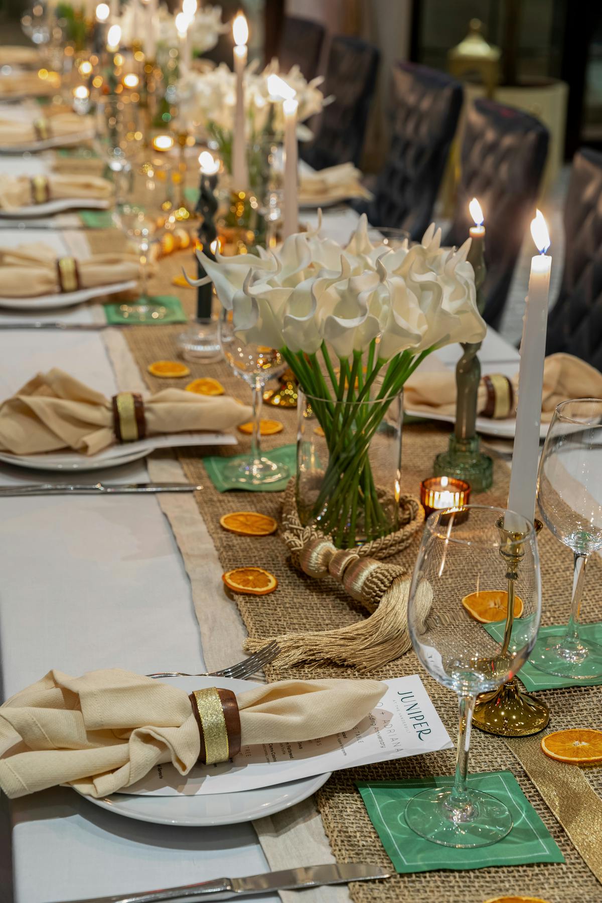 a plate of food and glasses of wine on a table
