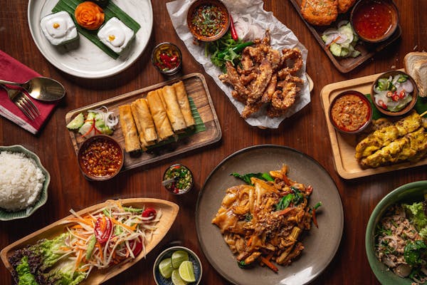 a bunch of food sitting on top of a wooden table