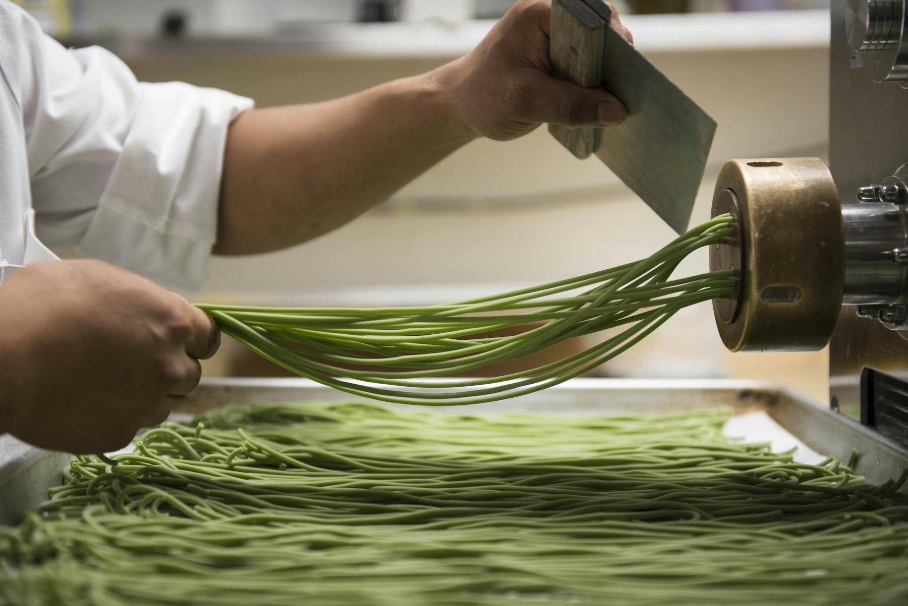 chef chopping green onions