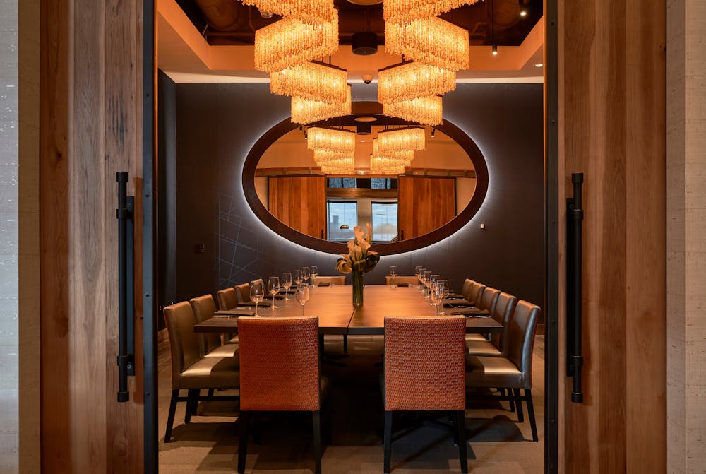 a dining room table in front of a window