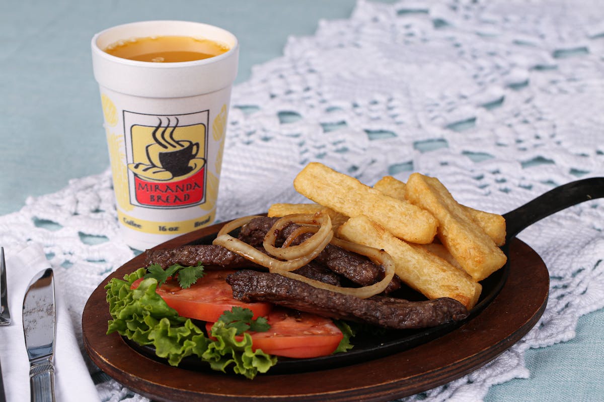a plate of food and a cup of coffee