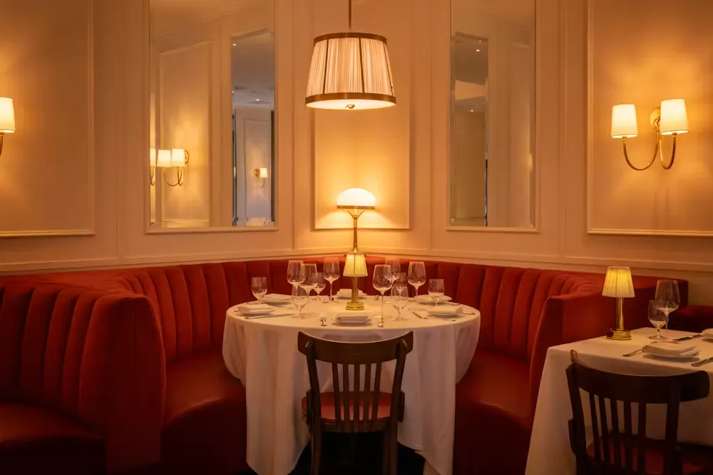 a table with a table set up and a lamp