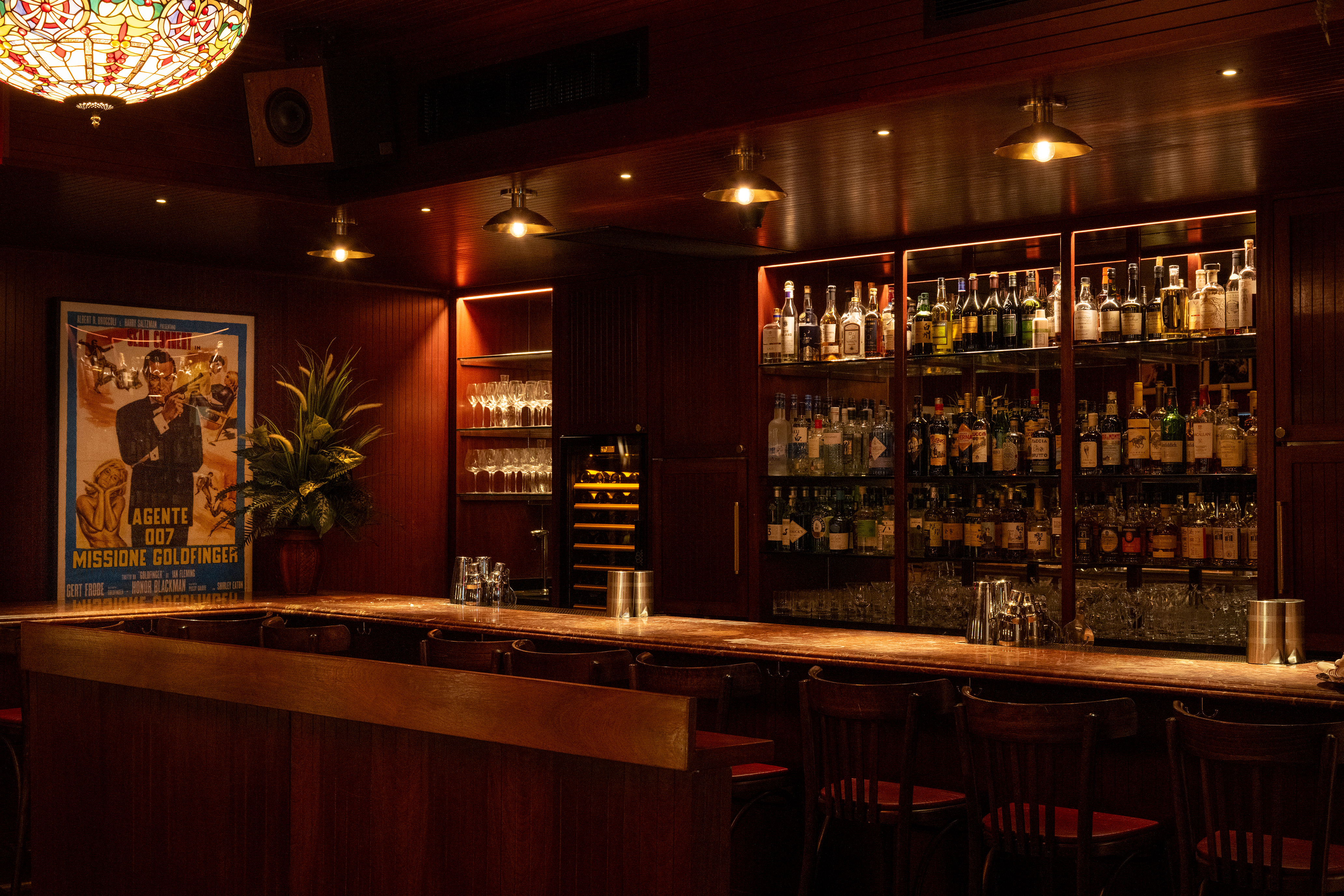 a bar with shelves of liquor and bottles