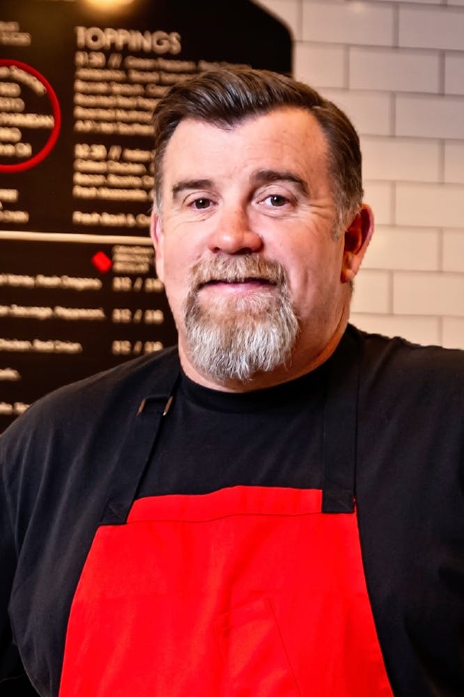 a man standing in front of a counter