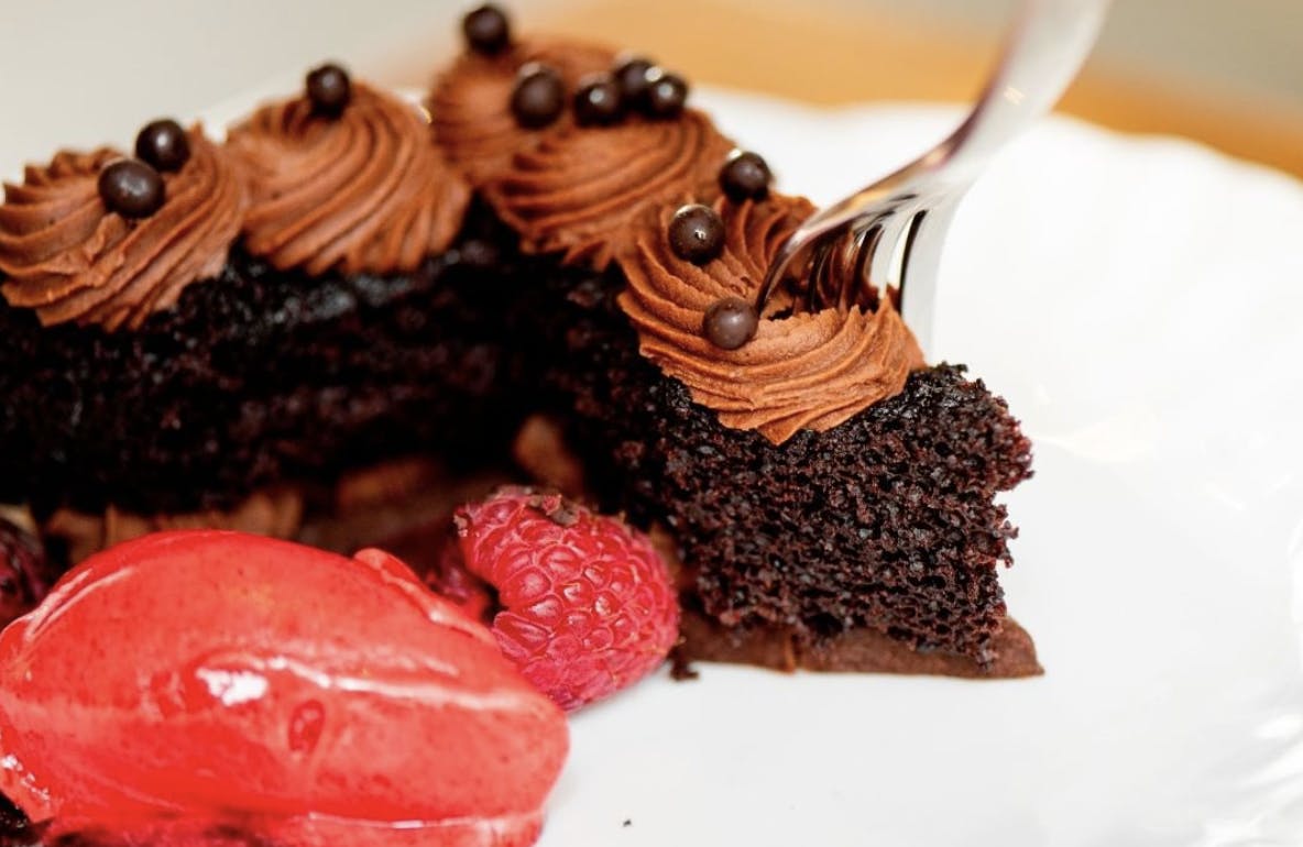 a close up of a piece of chocolate cake on a plate