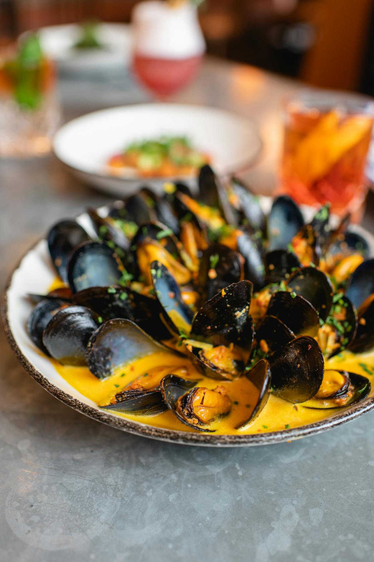 a plate of mussels on a table