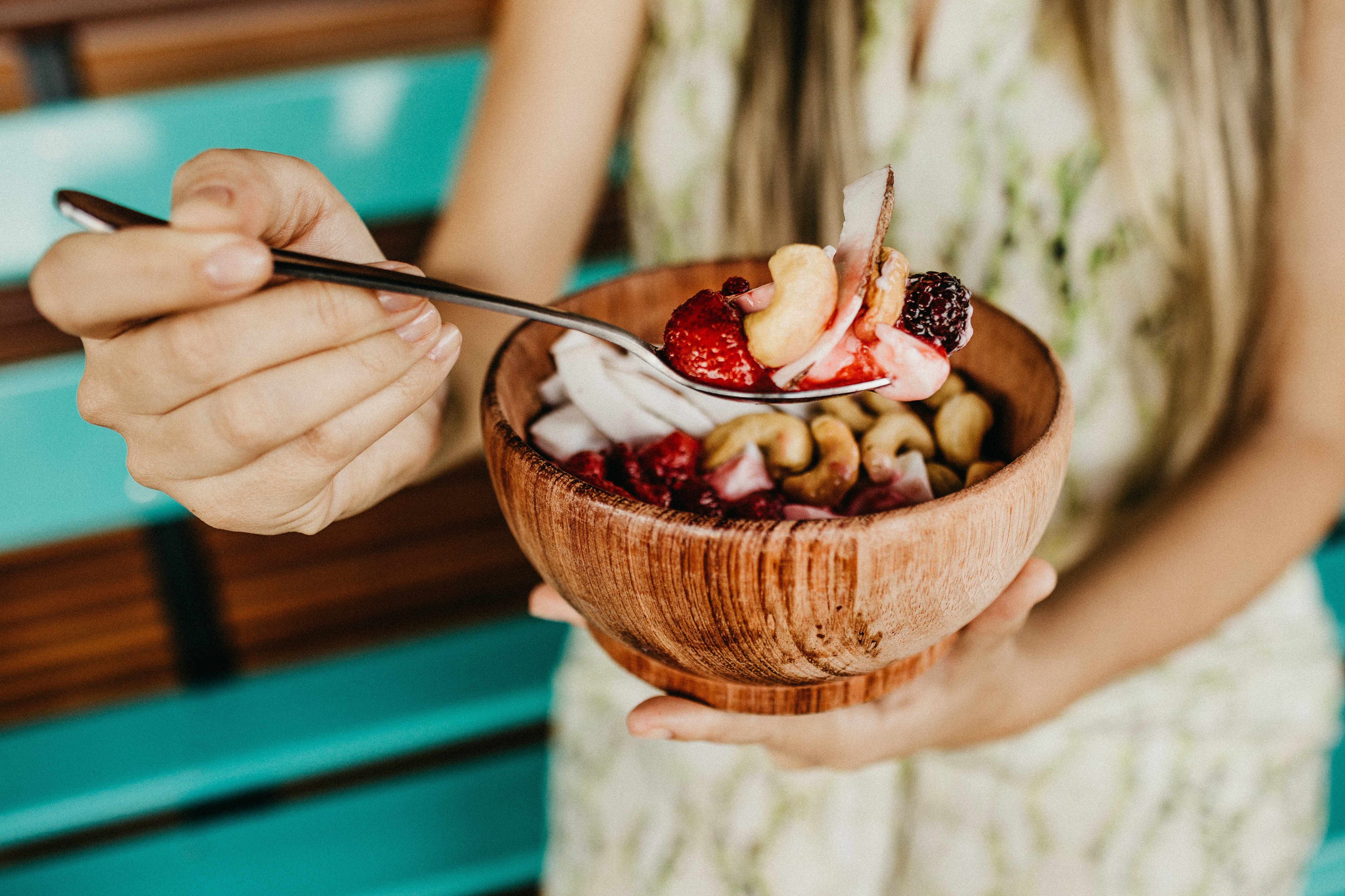 a person sitting in a bowl on a table