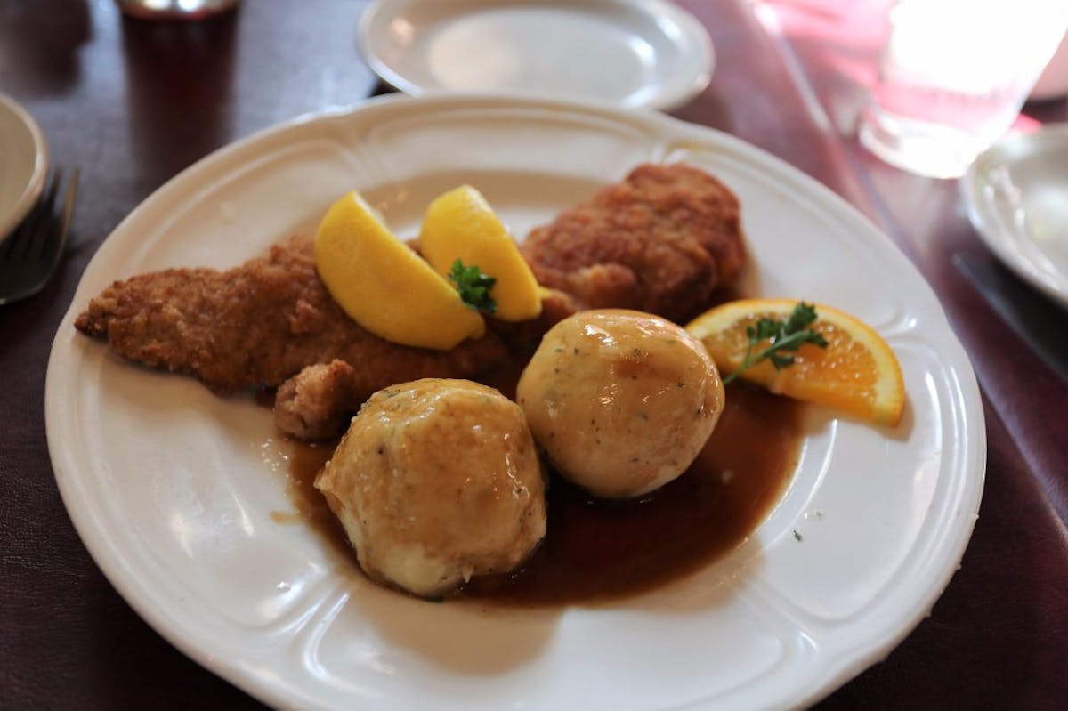 a plate of chickenon a table