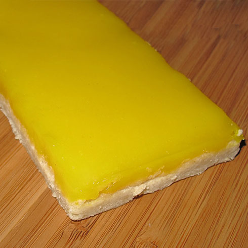 a banana sitting on top of a wooden cutting board