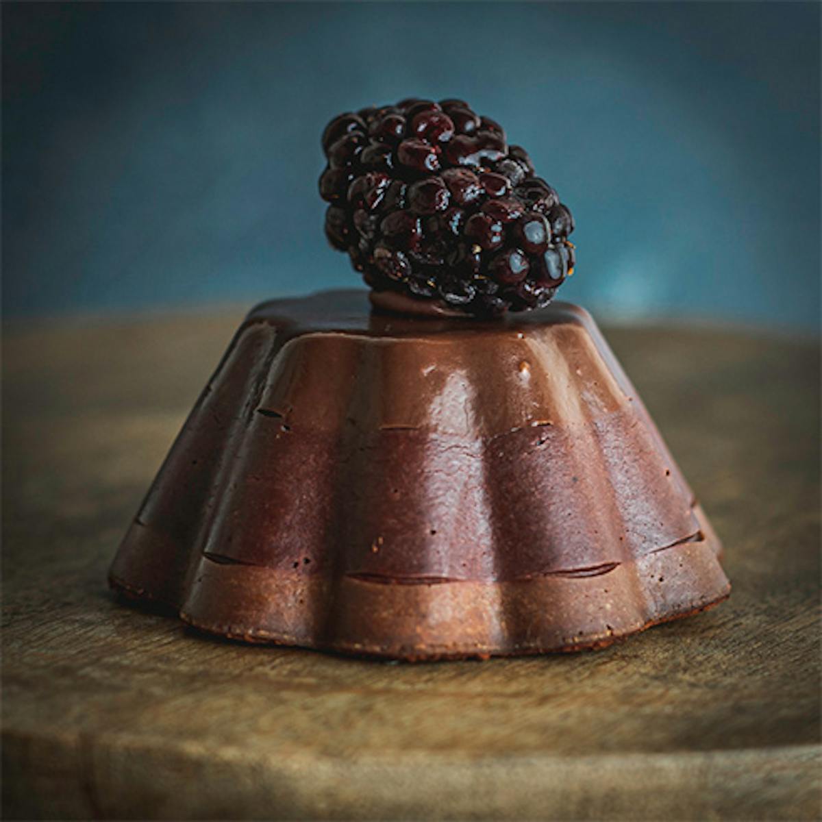 a cake sitting on top of a wooden table