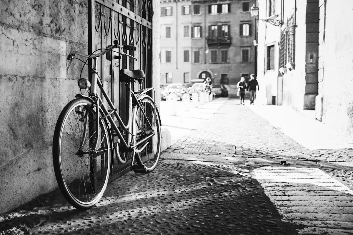 a bicycle parked on the side of a building