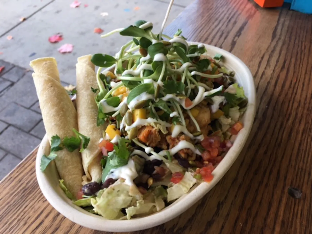a bowl of salad on a plate