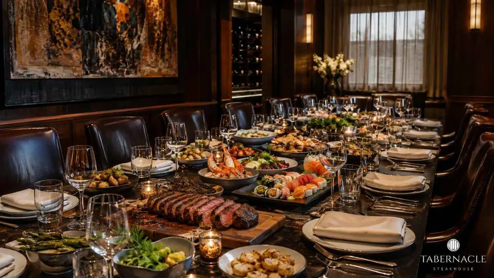 banquet-table-set-for-large-group-with-steak-sushi-and-seafood