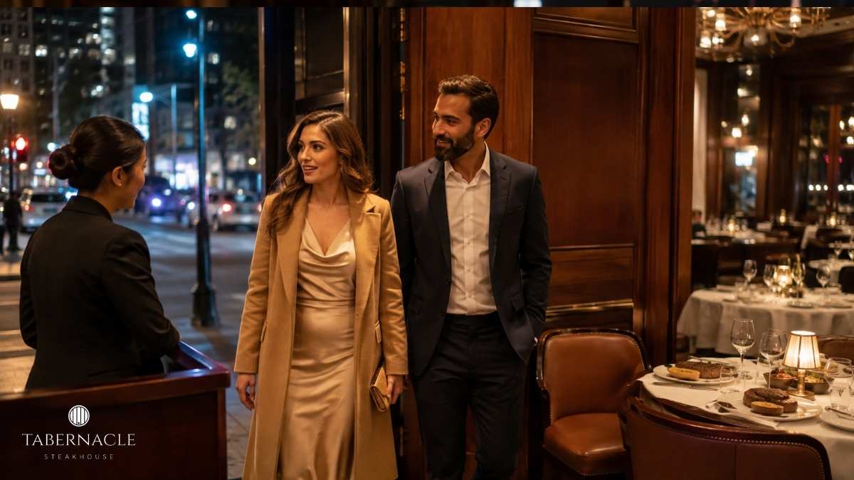 couple-arriving-at-upscale-steakhouse-greeted-by-hostess