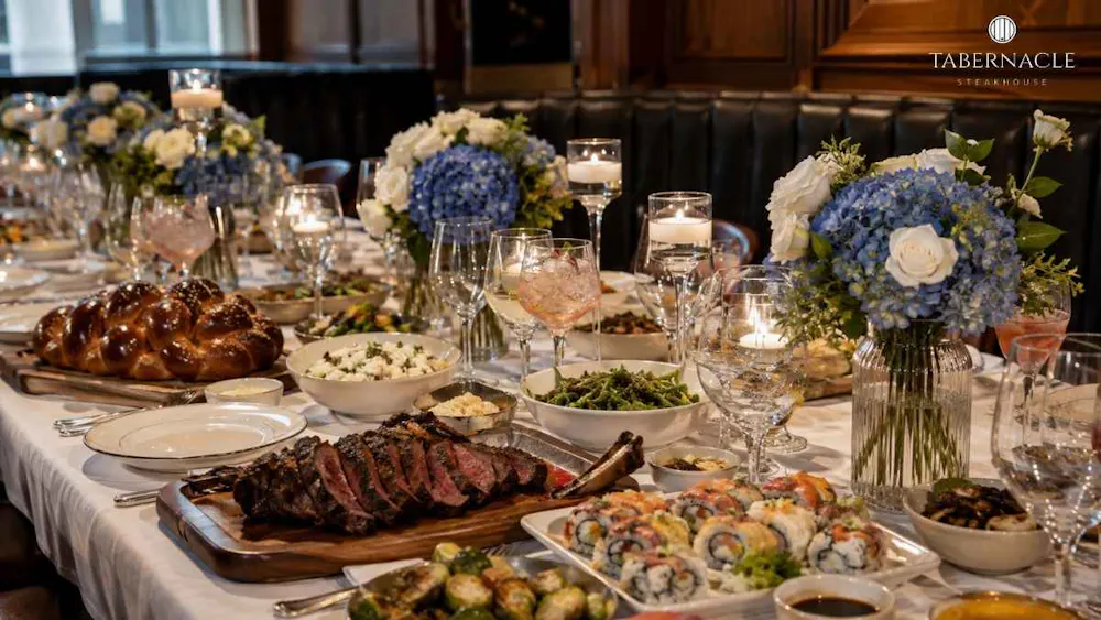 kosher-feast-spread-with-challah-steak-sushi-and-floral-decor