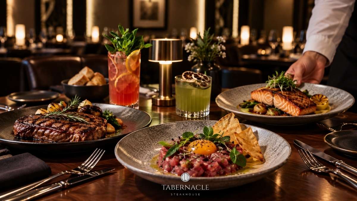 a table with plates of food and drinks
