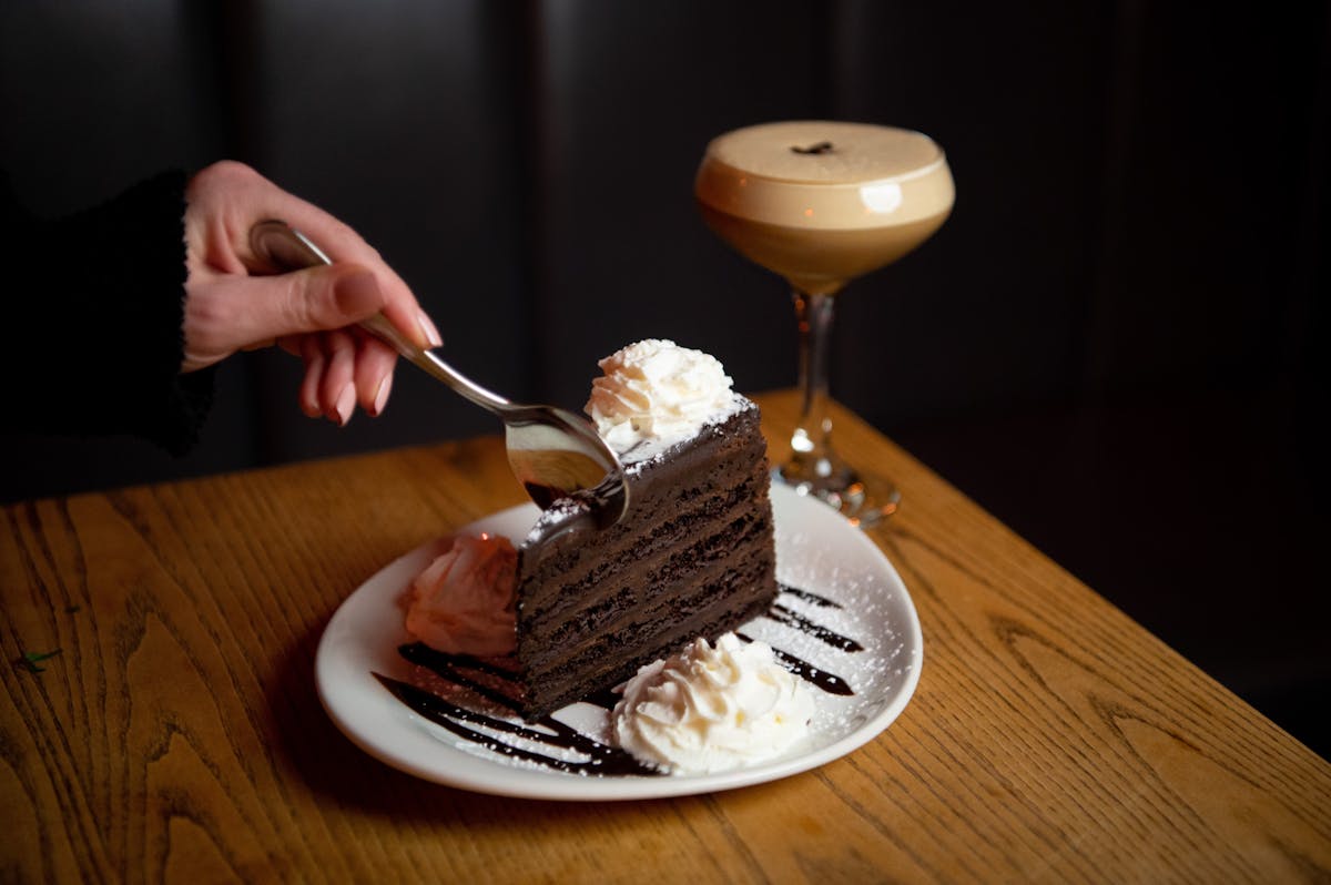 a piece of cake sitting on top of a wooden table