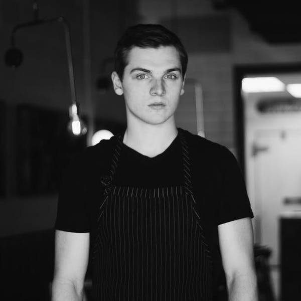 a man standing in a dark room