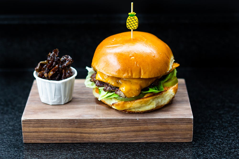 a sandwich sitting on top of a wooden table