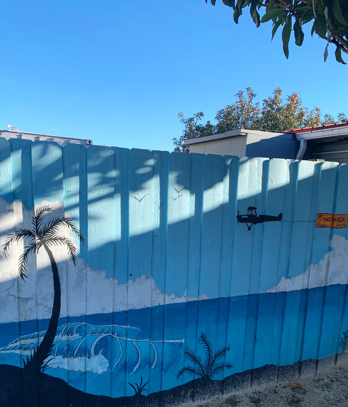a building with graffiti on the side of a ramp