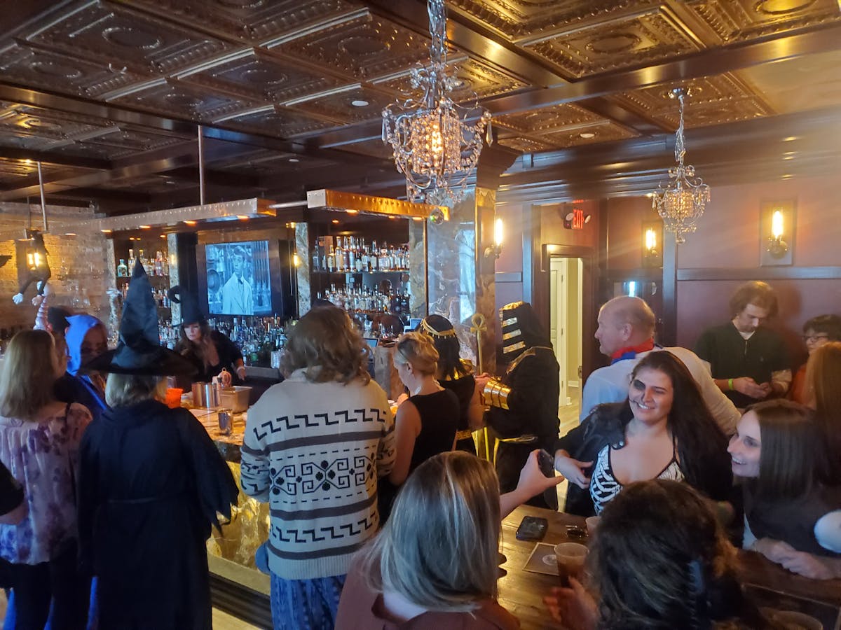 a group of people sitting at a table in a restaurant