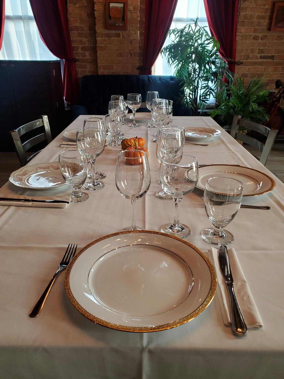 a dining table with wine glasses