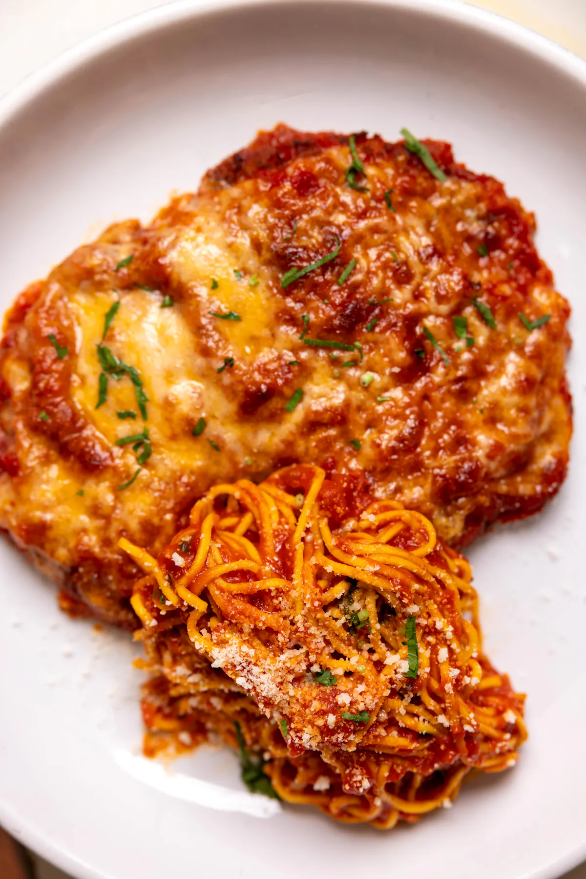 a plate of food with a slice of pizza