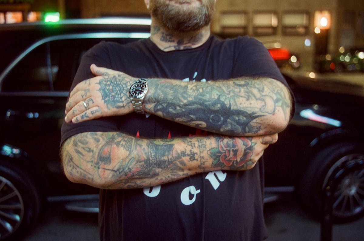 nick collela arms crossed tattoos