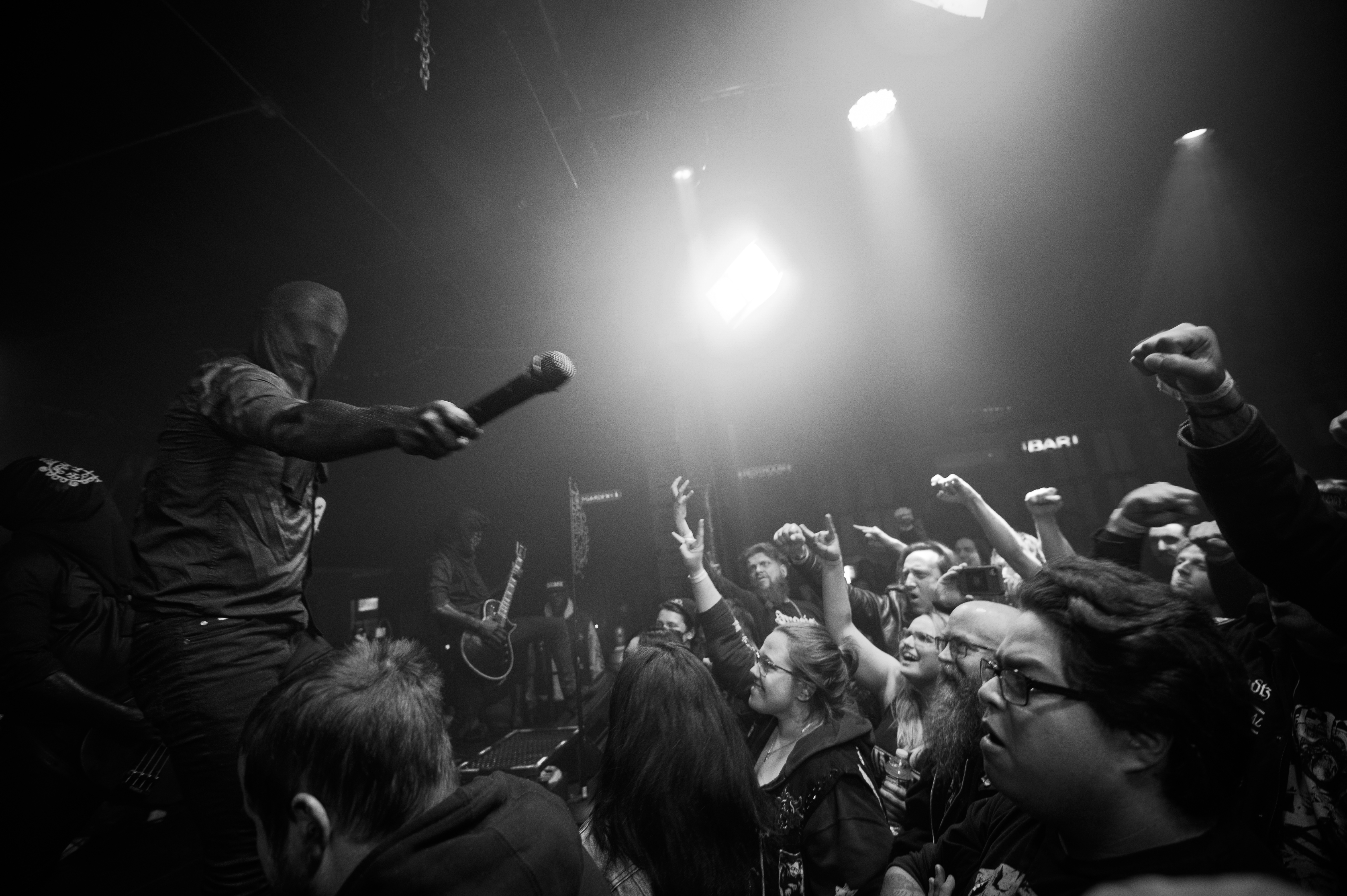 a group of people on a stage in front of a crowd