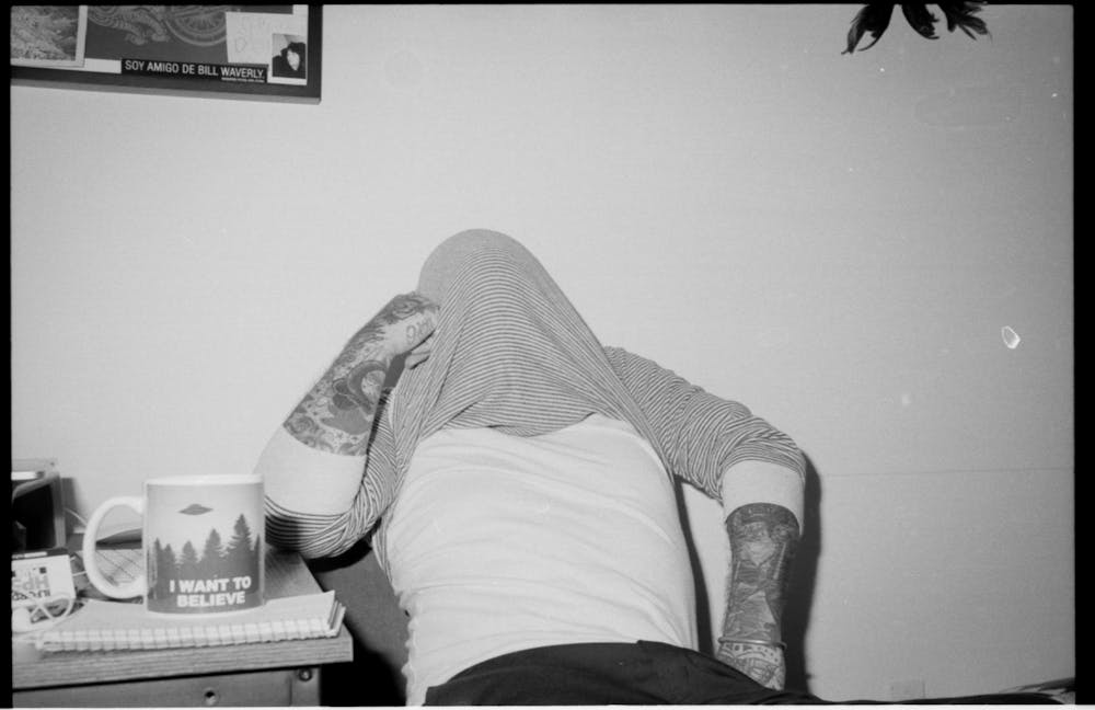 a person sitting on a bed