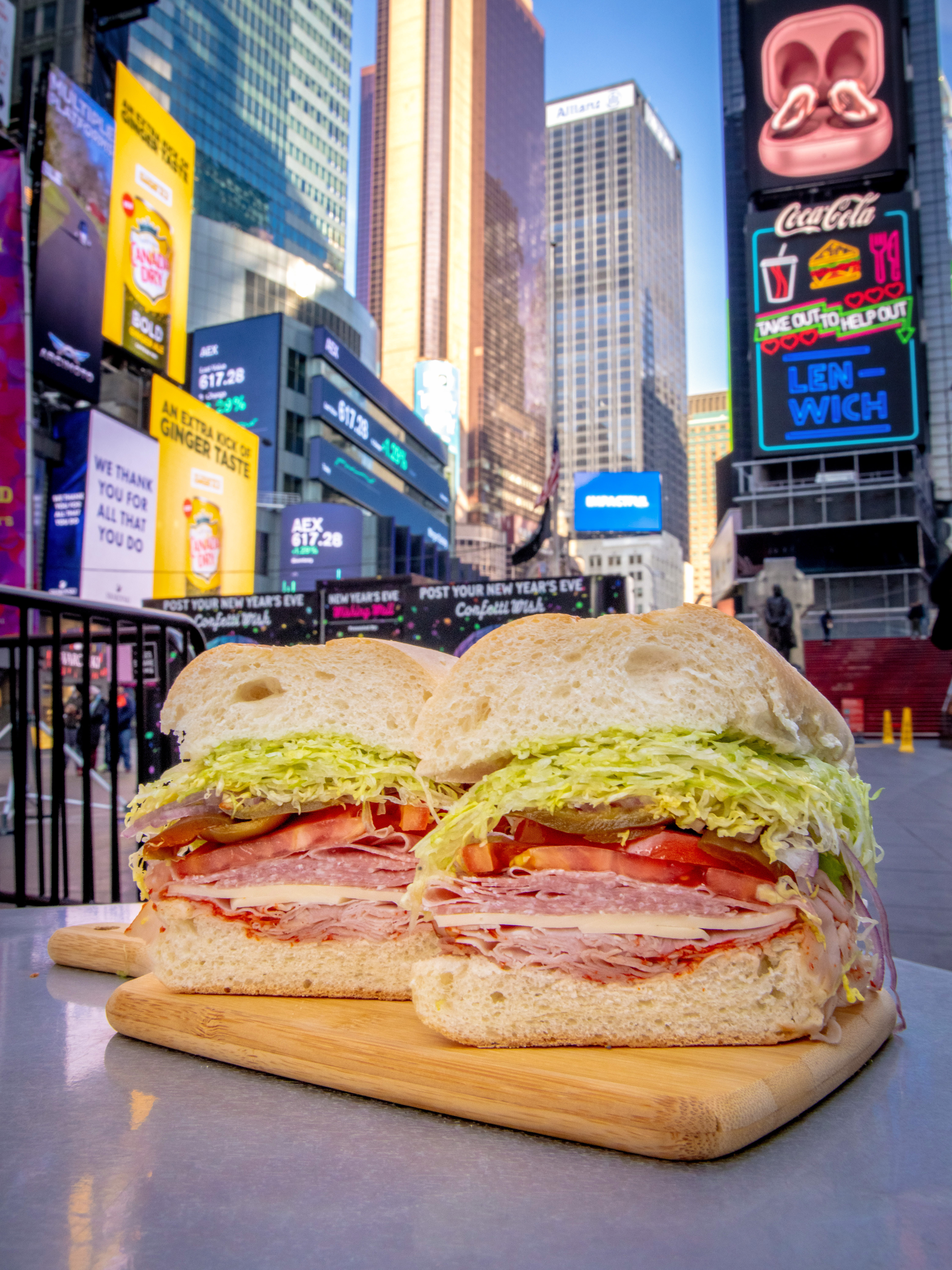 a cut in half sandwich sitting on top of a table