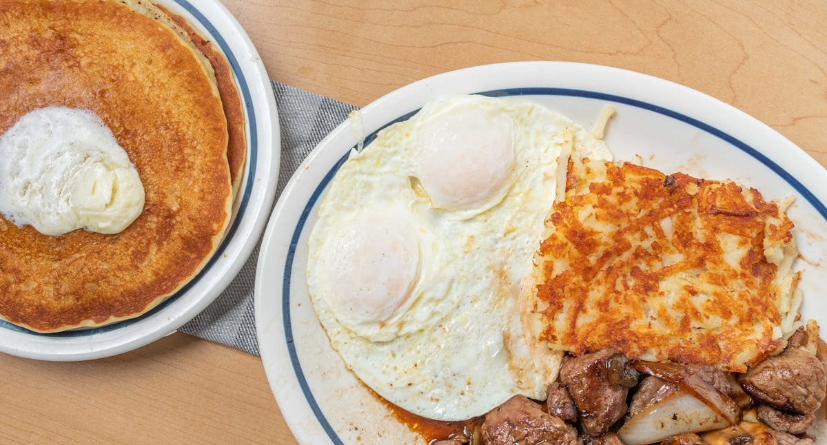 a plate of breakfast food is sitting on a table