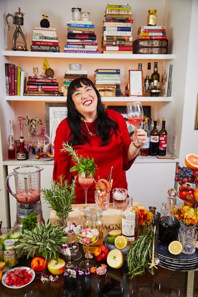 Belinda Chang sitting at a table with food