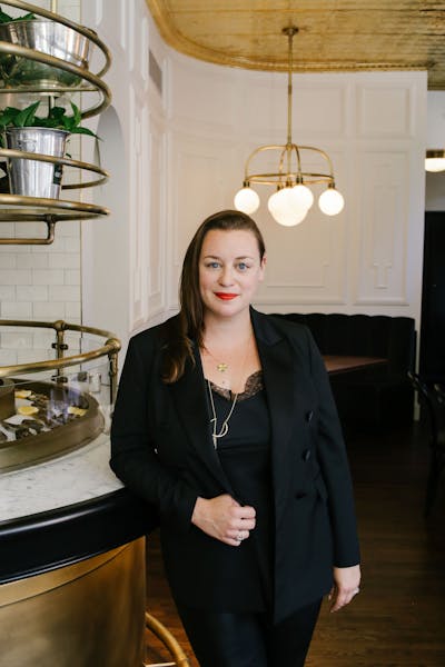 a woman standing in a kitchen