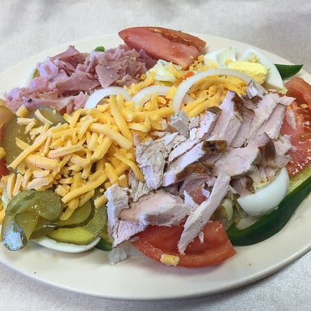 a plate of food that is on the side of fries