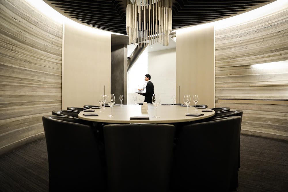 a person standing in front of a mirror posing for the camera