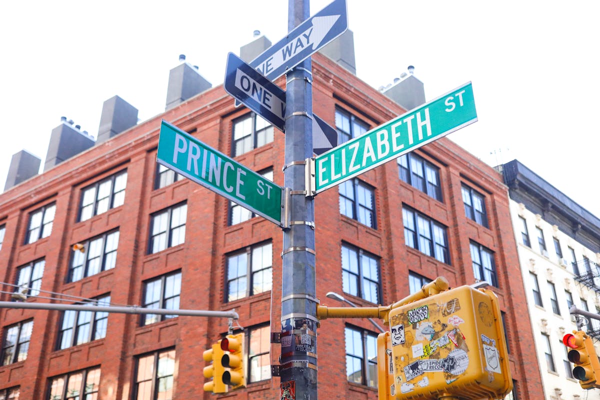 a close up of a street sign in front of a building