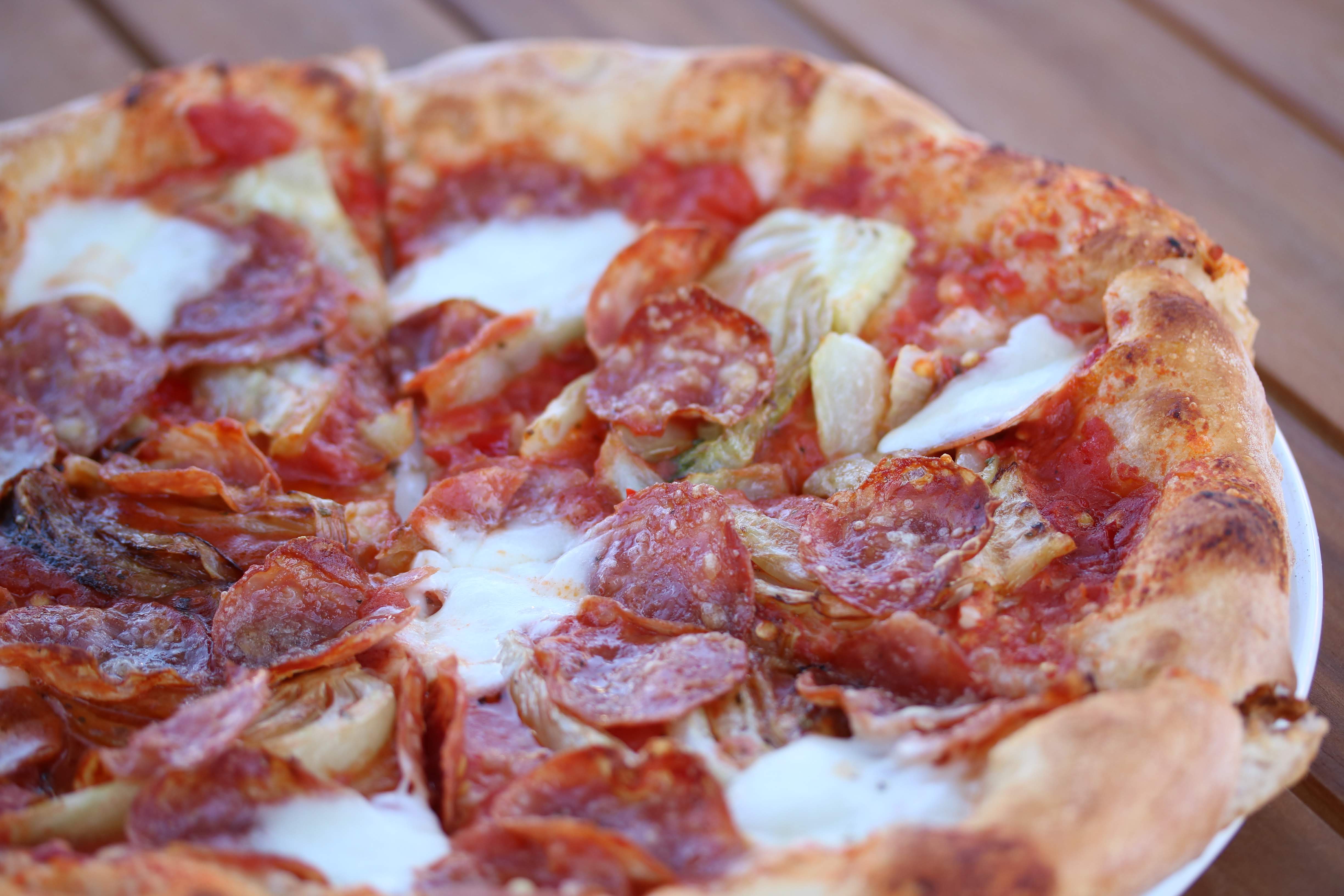 a close up of a slice of pizza