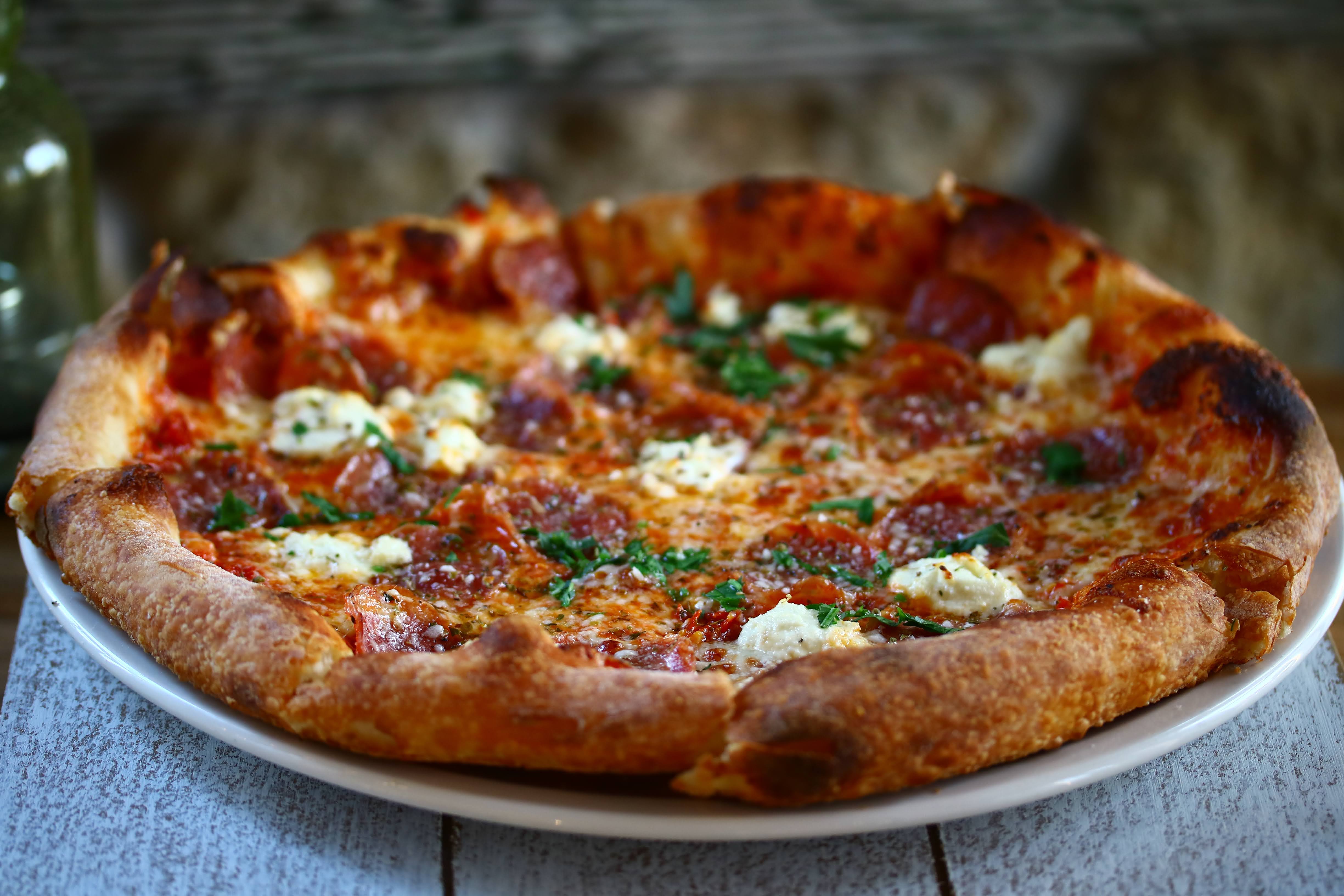 a pizza sitting on top of a table