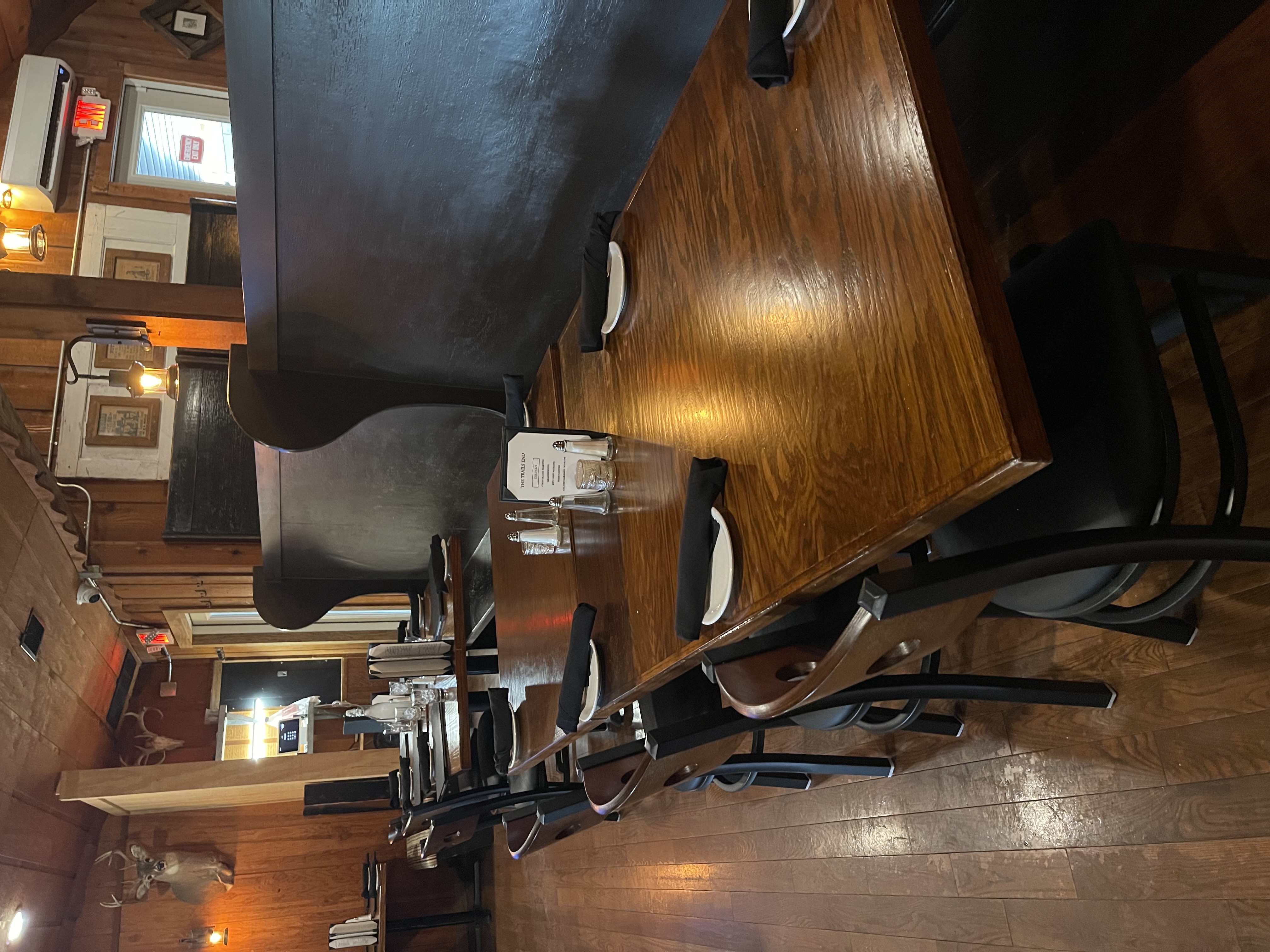 a table with plates and napkins in a restaurant