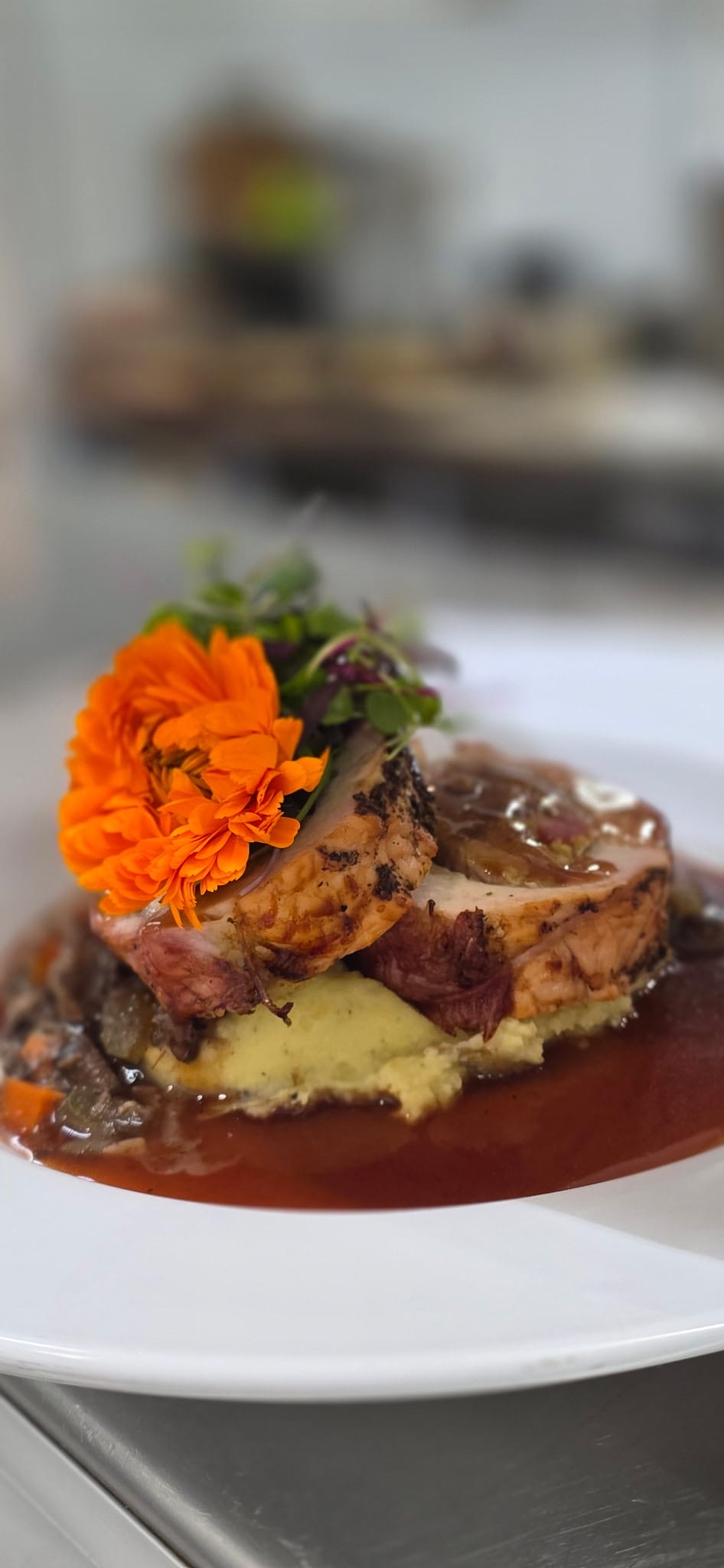 a plate of food with a flower on top