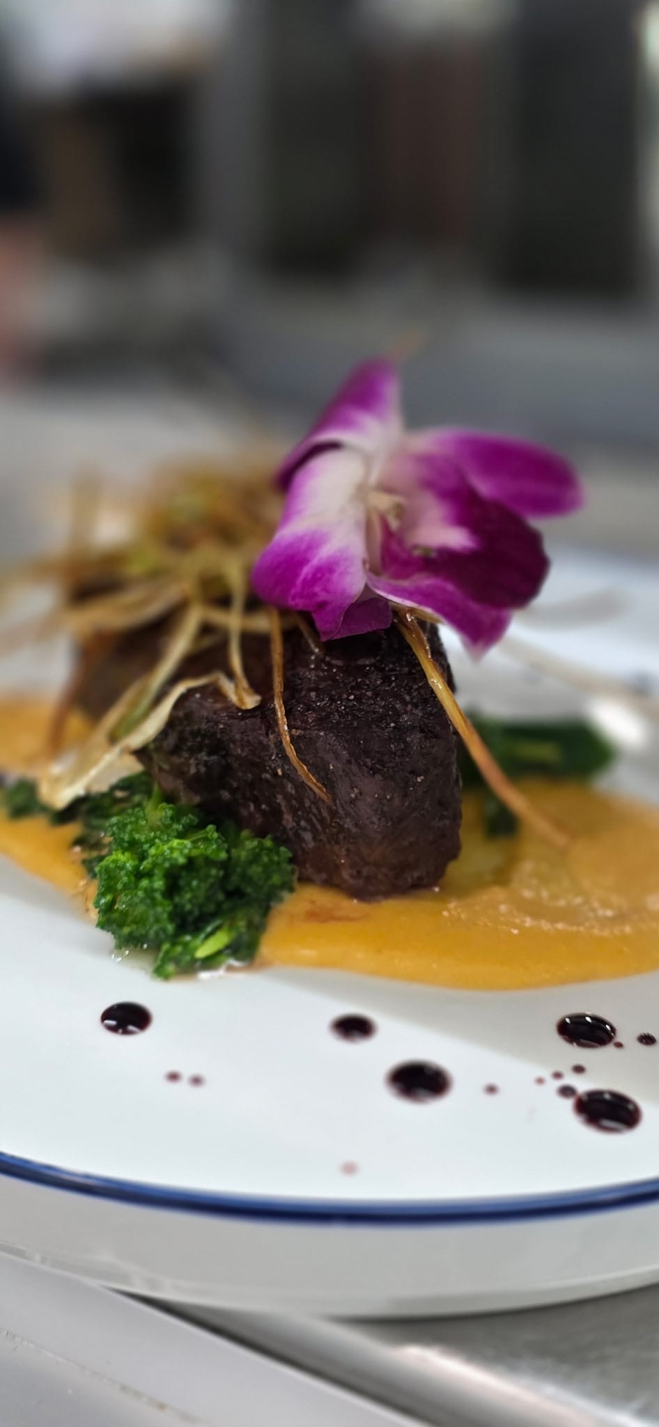 a plate of food with a flower on top
