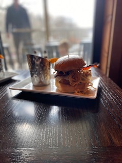 a cat sitting on top of a wooden table