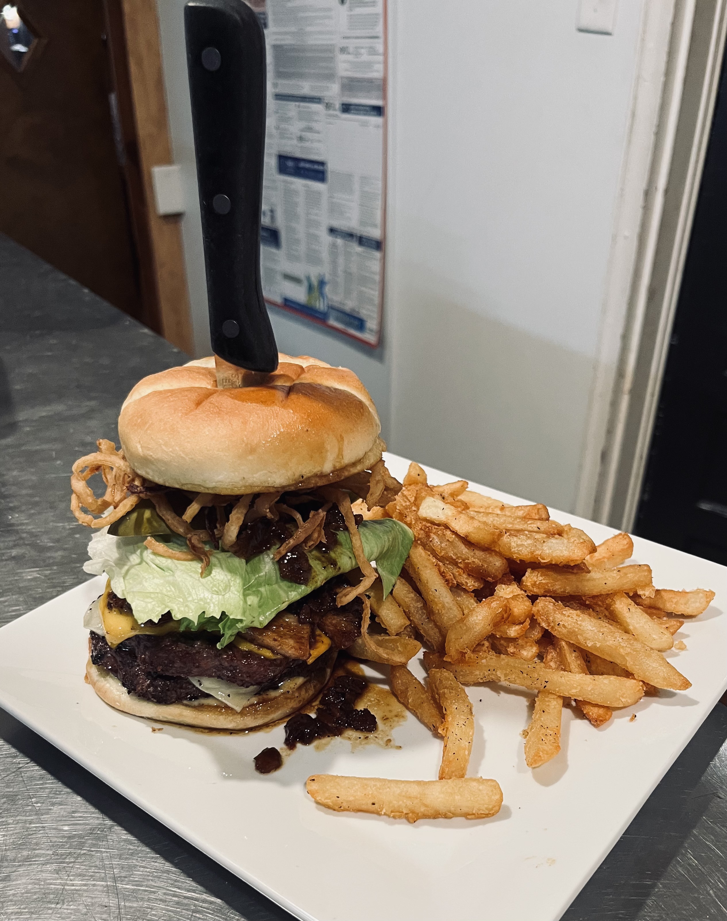 a burger with a knife on it