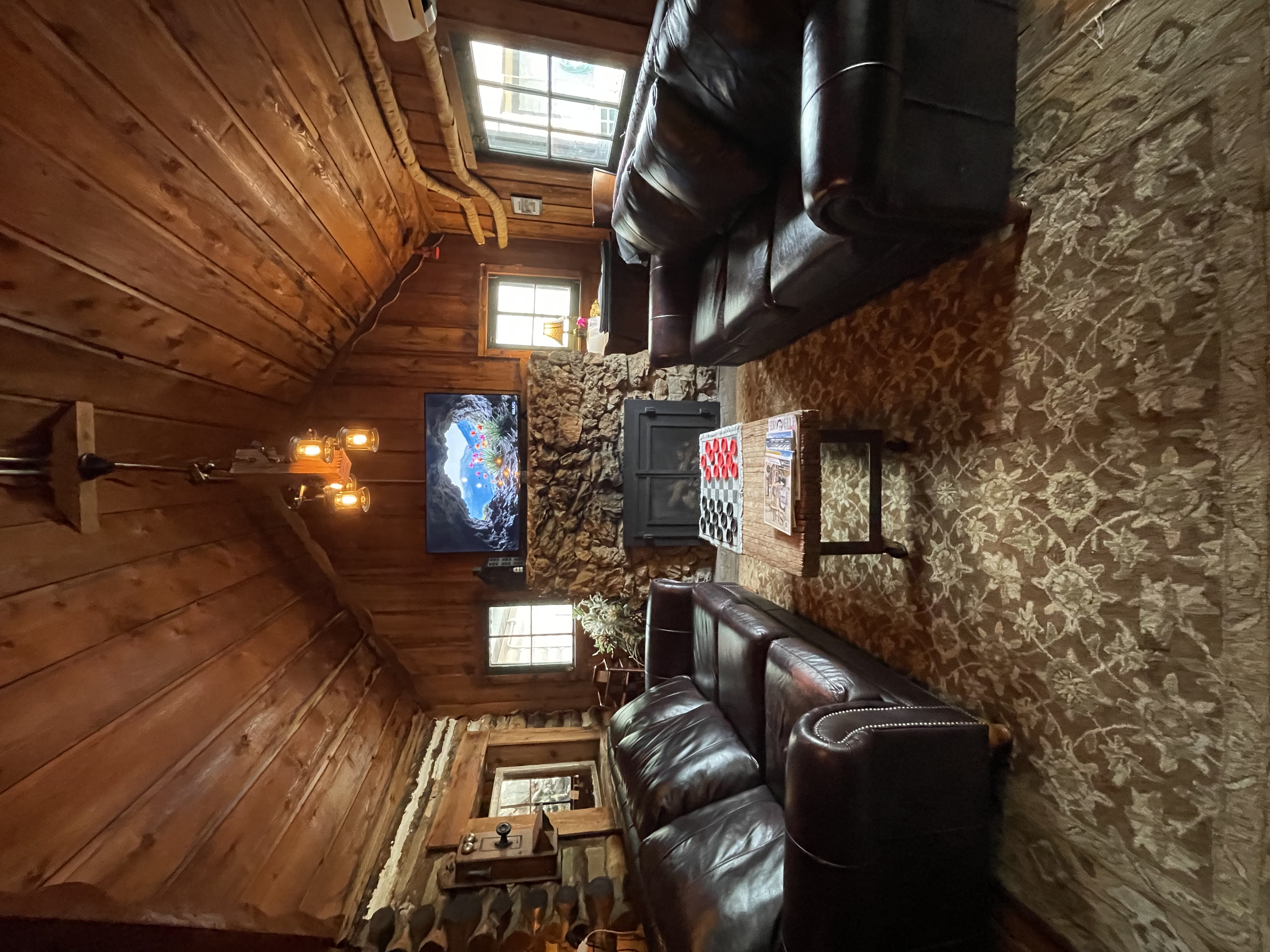 a room with a fireplace and couches