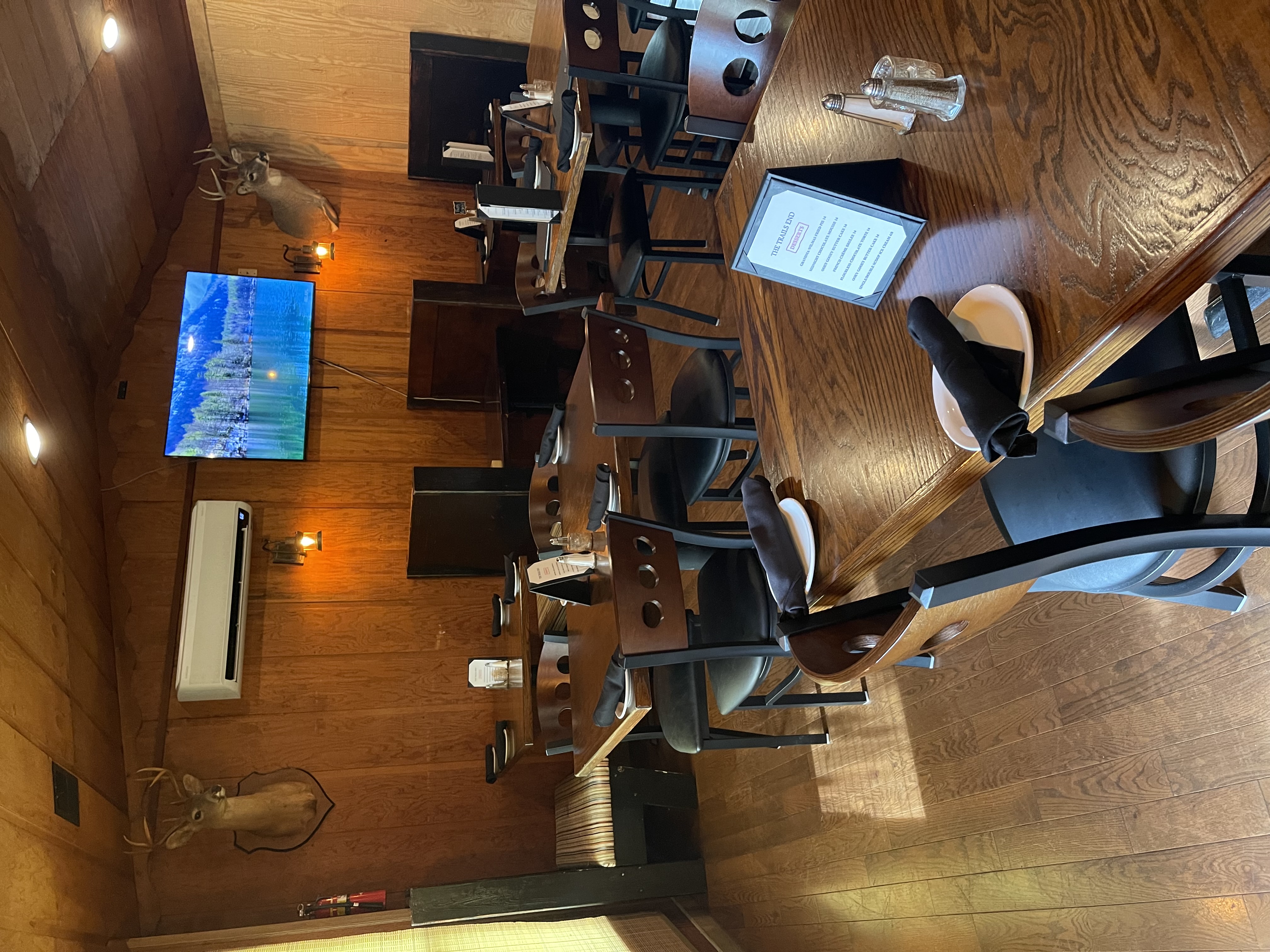 a room with wooden tables and chairs