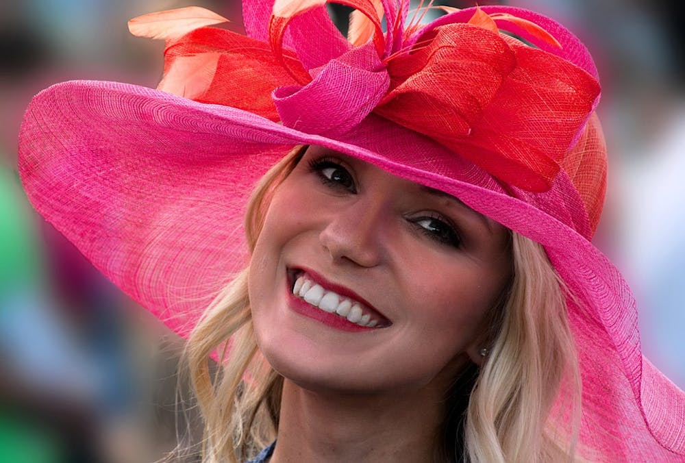 a close up of a woman wearing a hat