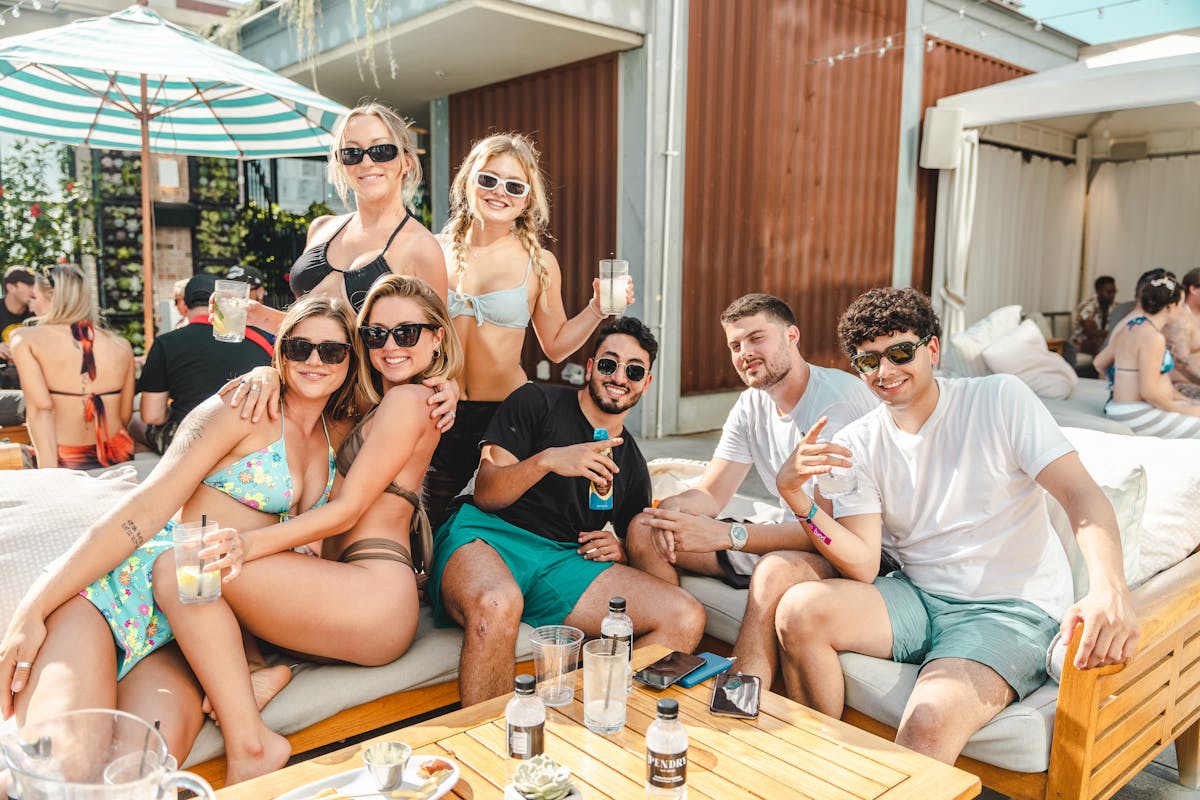 a group of people sitting on a bench