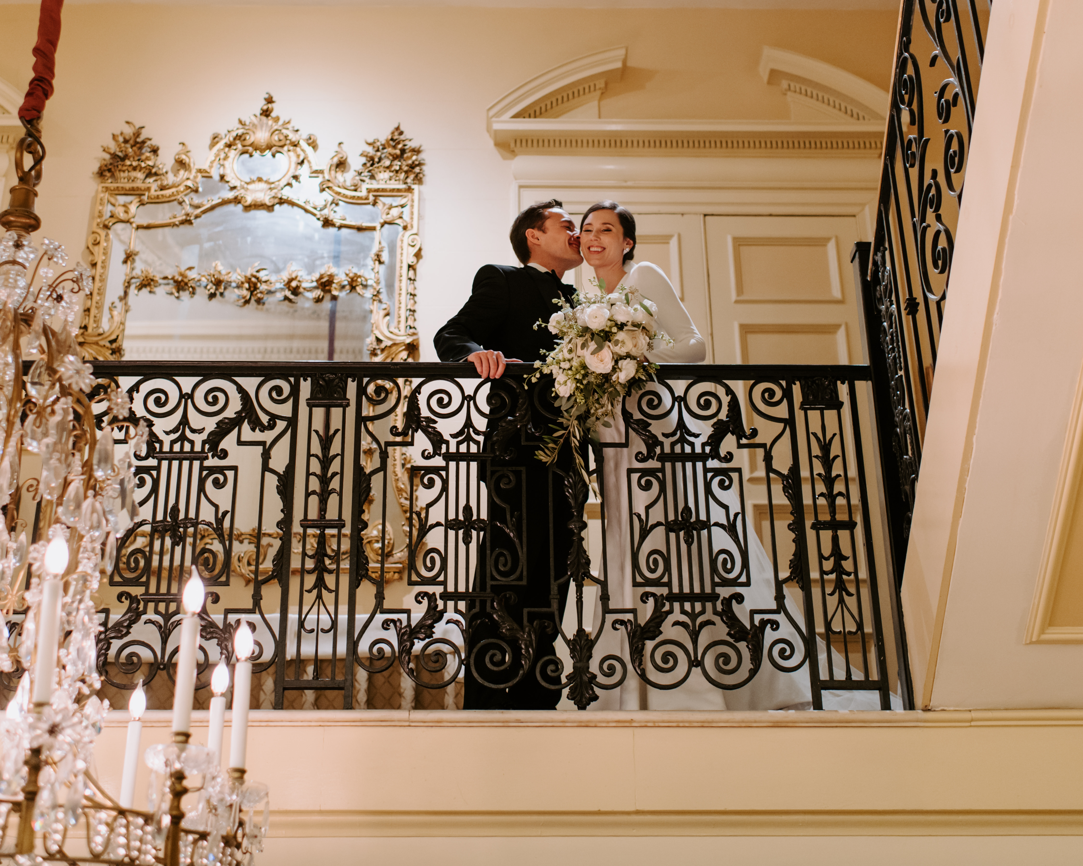 a bride and groom posing for a camera