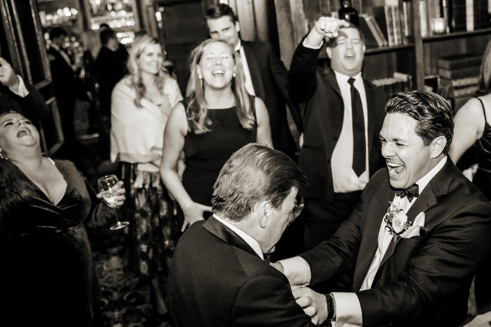 A full and exciting dancefloor filled with guests dressed to the nines in black tie!